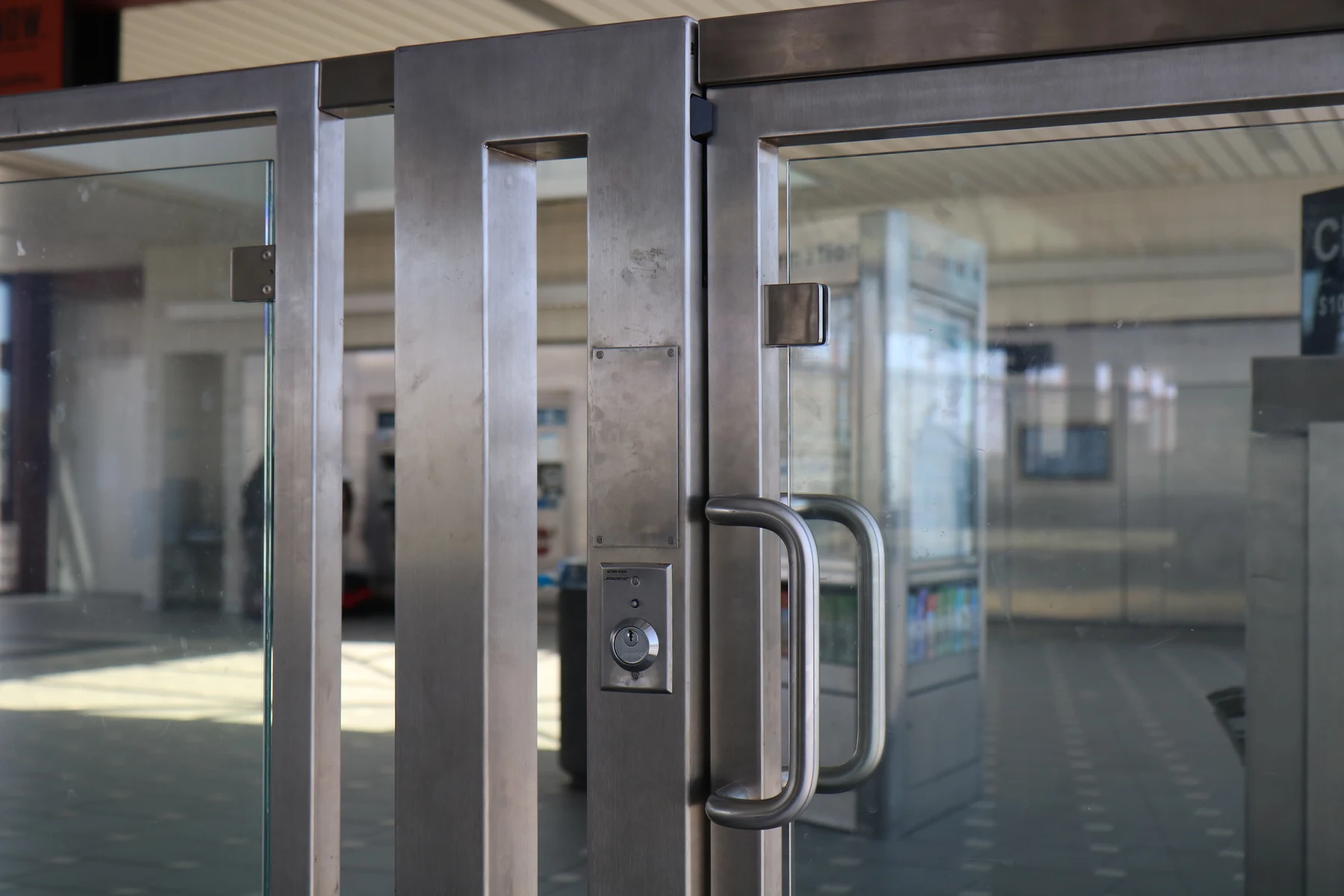 Stainless steel gate post with a pull handle and keyed locking hardware